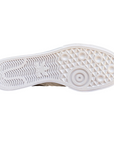 Sneakers Adidas Nizza Platform bianche da donna con suola rialzata, tomaia in canvas, dettagli in pelle e logo Adidas laterale - suola
