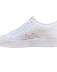 Sneakers Adidas Nizza Platform bianche da donna con suola rialzata, tomaia in canvas, dettagli in pelle e logo Adidas laterale - interna