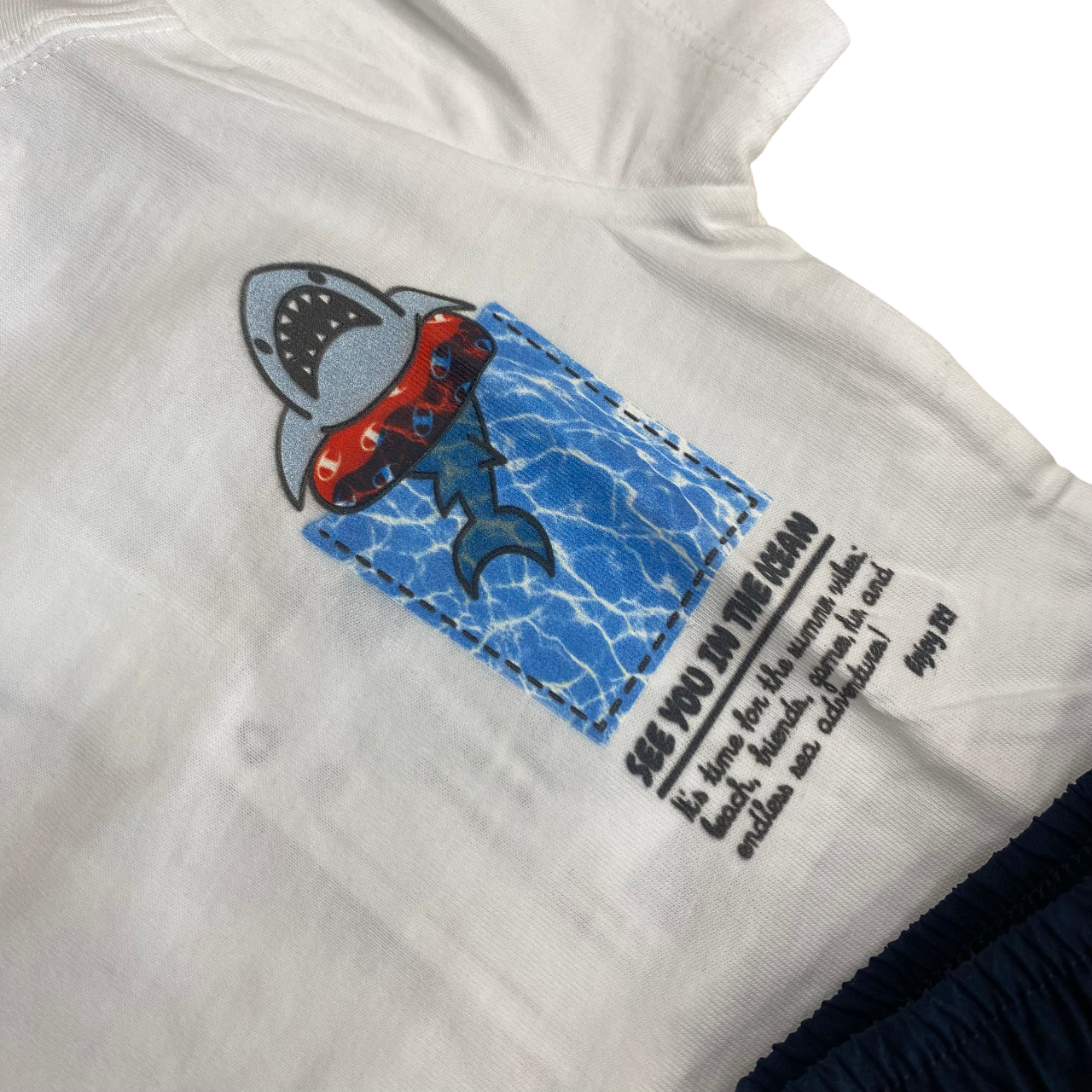Set estivo Champion per bambini modello 307065 WW001 bianco e blu, completino infant originale - dettaglio
