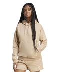 Felpa Adidas Essentials JV7310 sabbia donna con cappuccio, vista frontale