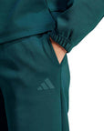 Pantalone sportivo Adidas donna JX0443 verde in misto cotone. Comfort e stile per sport e tempo libero. tasca