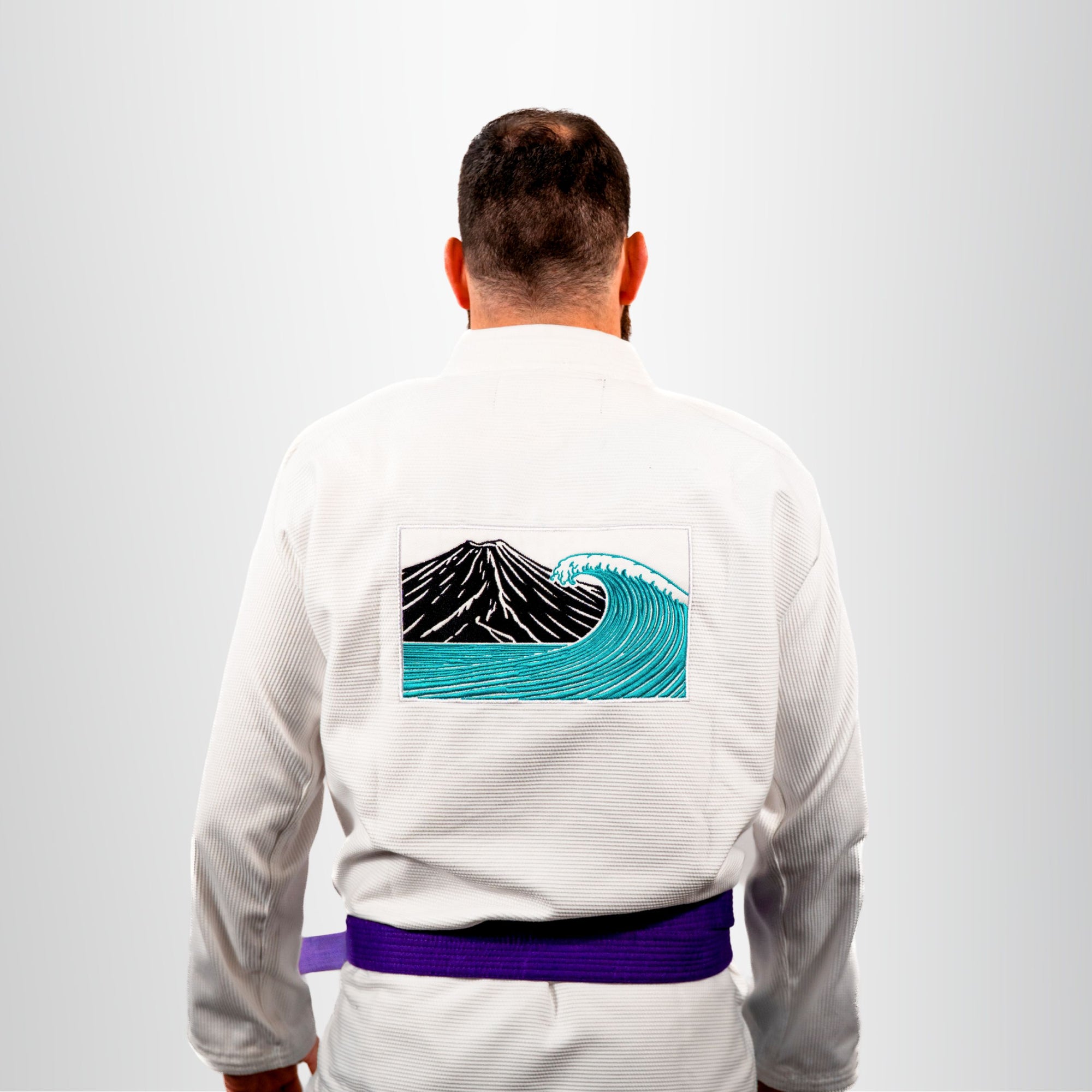 Ethnos Gi Kimono Eudaimonia Natural Way Bianco logo  etna ed onda