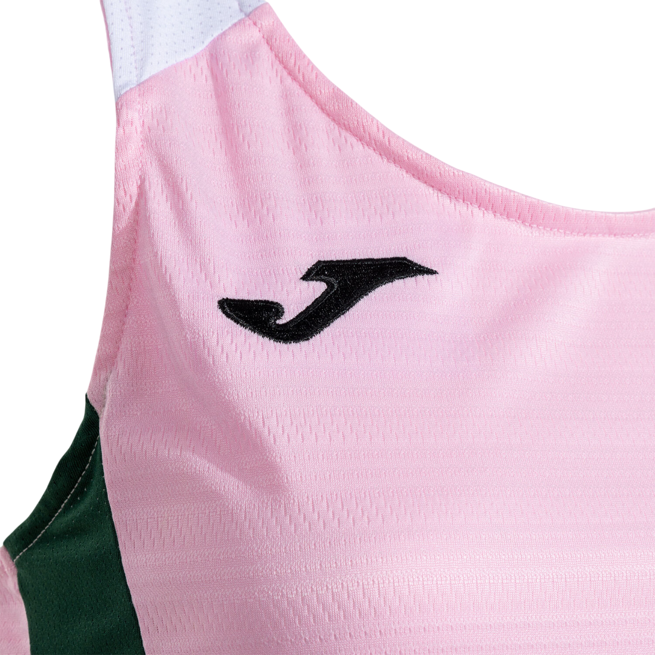 Dettaglio laterale della canotta fitness Joma rosa da donna, mostra la vestibilità e il taglio ergonomico per il comfort durante l'attività sportiva